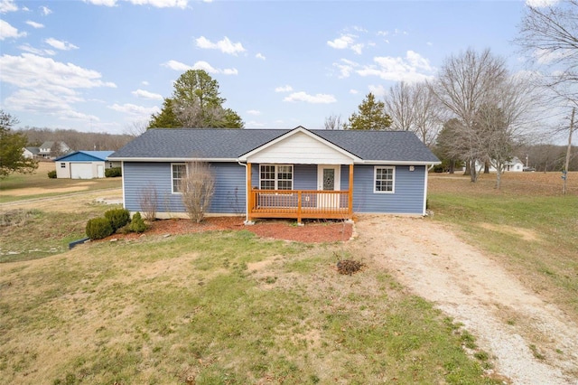 single story home with a porch and a front yard