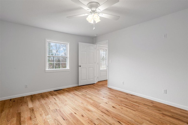 spare room with light hardwood / wood-style flooring and ceiling fan