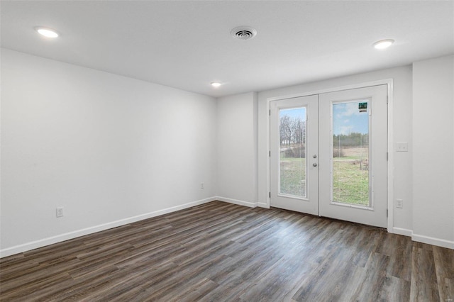 unfurnished room with dark hardwood / wood-style flooring and french doors