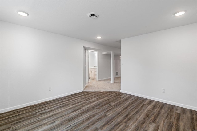 empty room with dark wood-type flooring