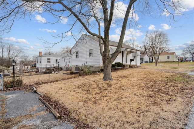 view of property exterior with central AC