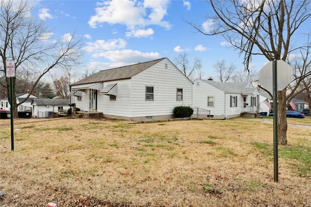 view of home's exterior with a yard