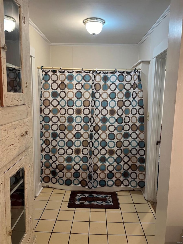 bathroom featuring tile patterned floors and crown molding