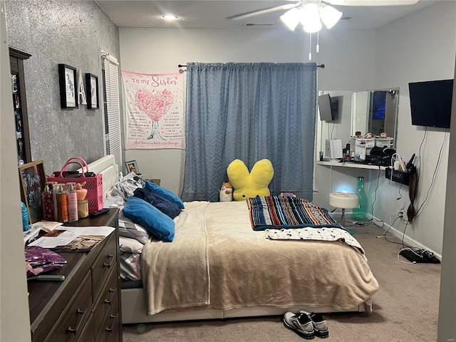 carpeted bedroom with ceiling fan