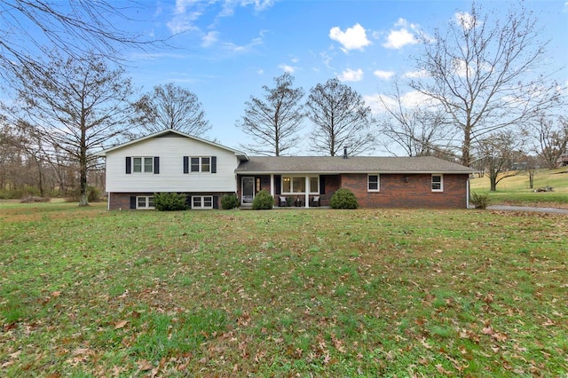 tri-level home with a front yard