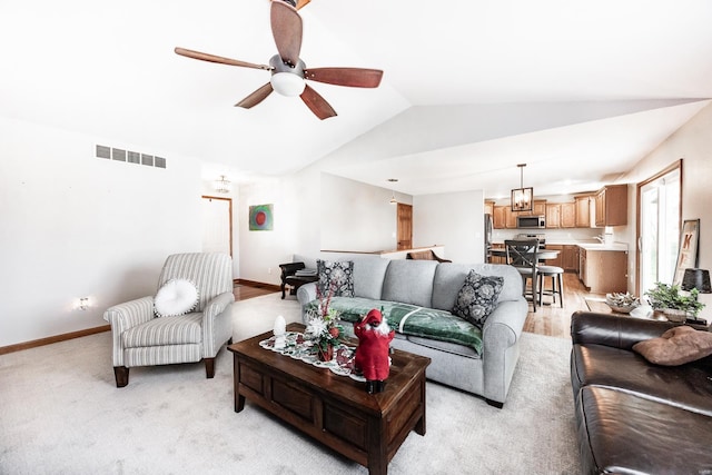 living room featuring lofted ceiling and ceiling fan