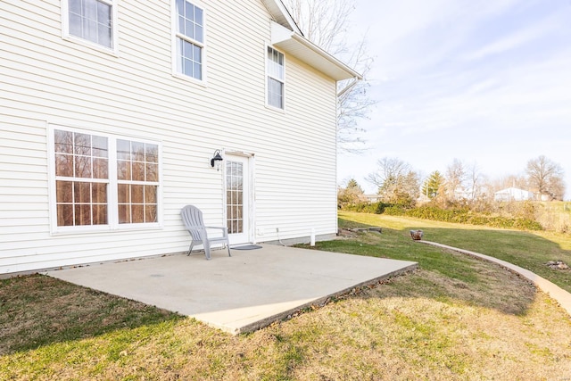 back of house featuring a yard and a patio