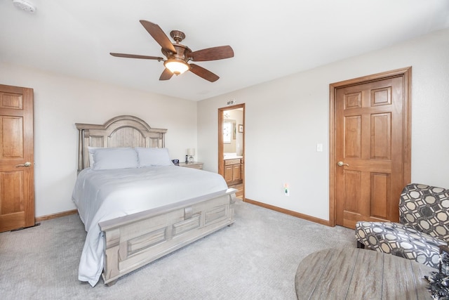 carpeted bedroom featuring ensuite bathroom and ceiling fan