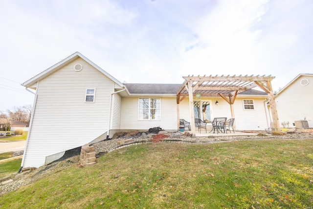 back of property with a lawn, cooling unit, a patio area, and a pergola