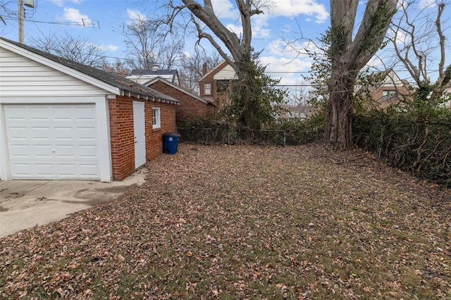 view of yard with an outbuilding and a garage