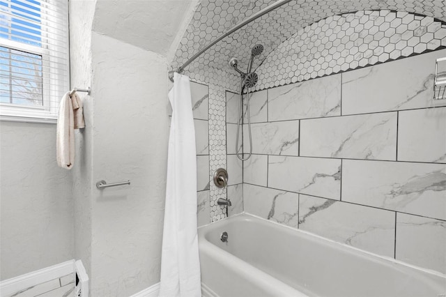 bathroom with shower / tub combo with curtain