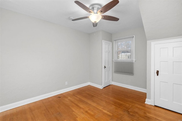 spare room featuring ceiling fan and wood-type flooring