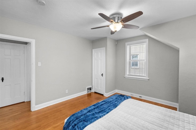 bedroom with ceiling fan and hardwood / wood-style floors