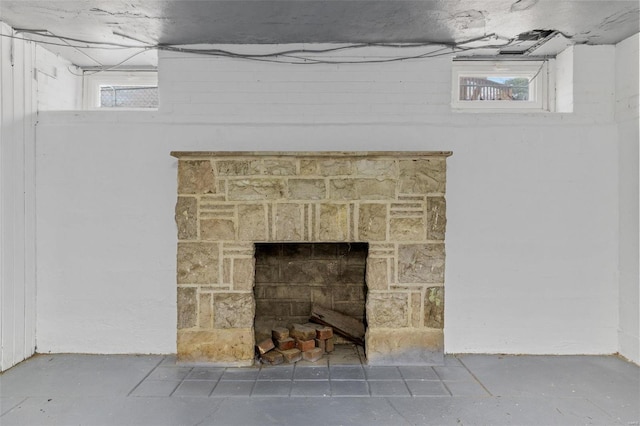 room details featuring a stone fireplace