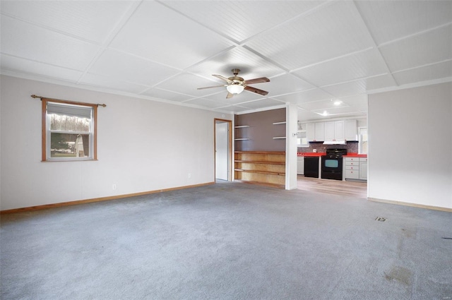 unfurnished living room with carpet flooring and ceiling fan