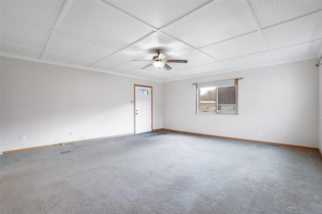 carpeted spare room with ceiling fan