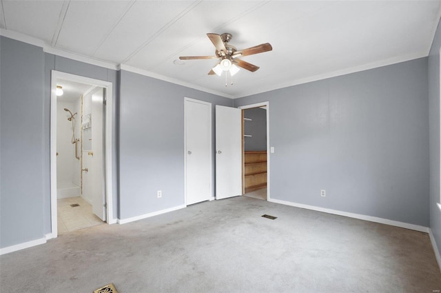 unfurnished bedroom featuring ceiling fan, crown molding, connected bathroom, and light carpet