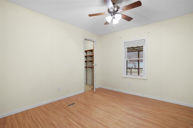 unfurnished room featuring light hardwood / wood-style floors and ceiling fan