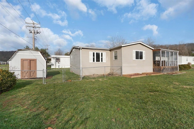 back of house featuring a yard and a sunroom