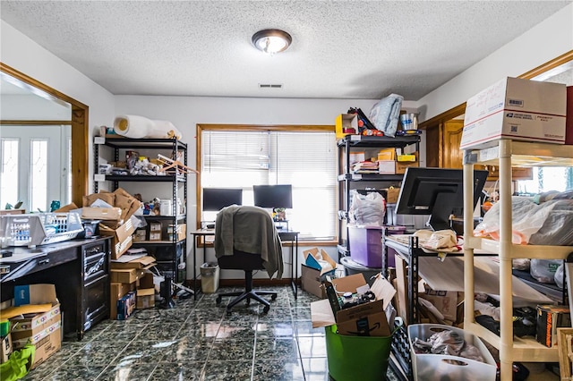 office featuring plenty of natural light and a textured ceiling