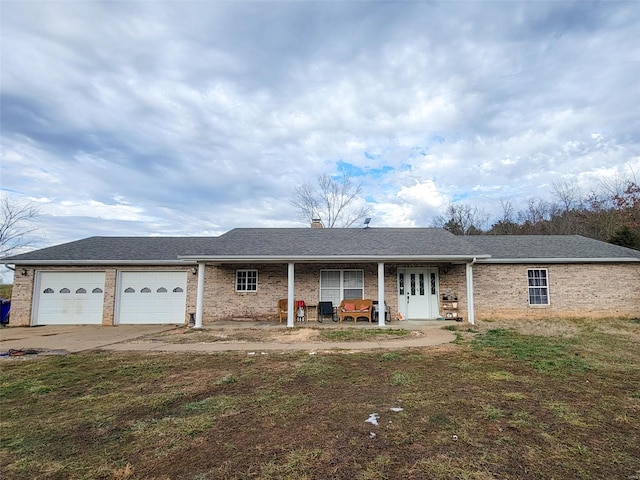 ranch-style house featuring a garage