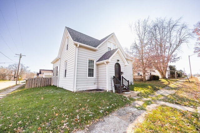 view of property exterior with a lawn