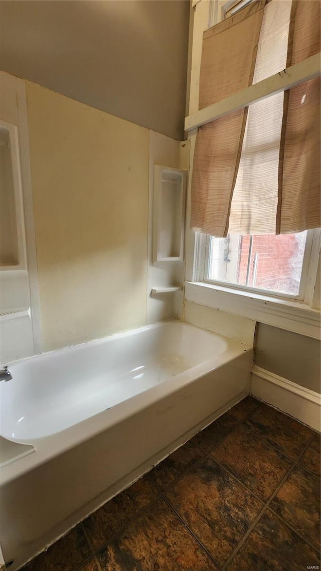 bathroom with a tub to relax in