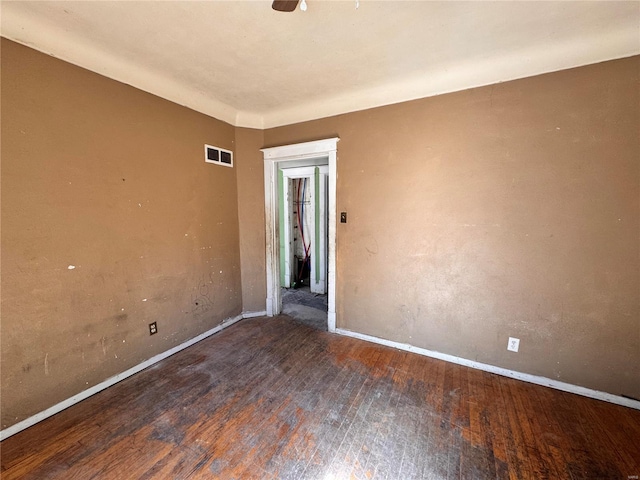 empty room featuring dark wood-type flooring