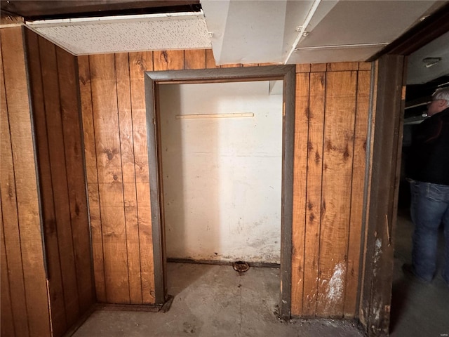 miscellaneous room with wooden walls