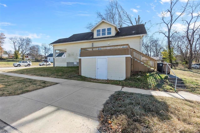 view of side of property with a lawn