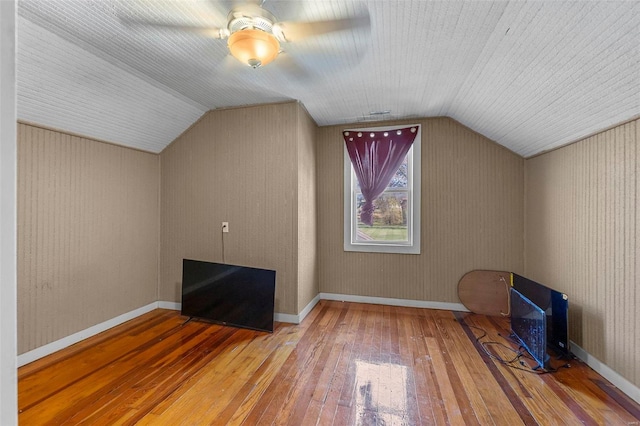 bonus room featuring hardwood / wood-style flooring, ceiling fan, and lofted ceiling