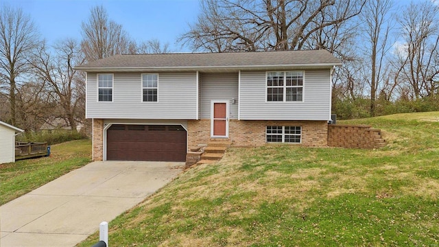 raised ranch featuring a front lawn and a garage