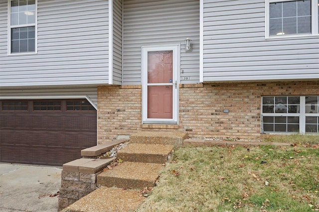 doorway to property featuring a garage