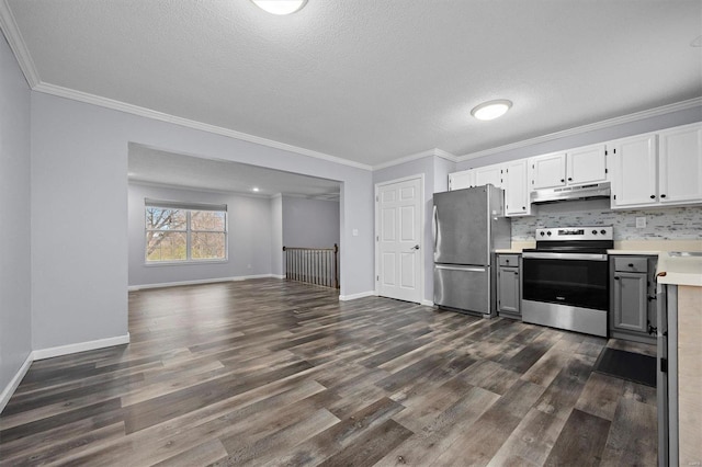 kitchen featuring white cabinetry, crown molding, dark hardwood / wood-style floors, and appliances with stainless steel finishes