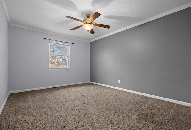 carpeted empty room featuring a textured ceiling, ceiling fan, and crown molding