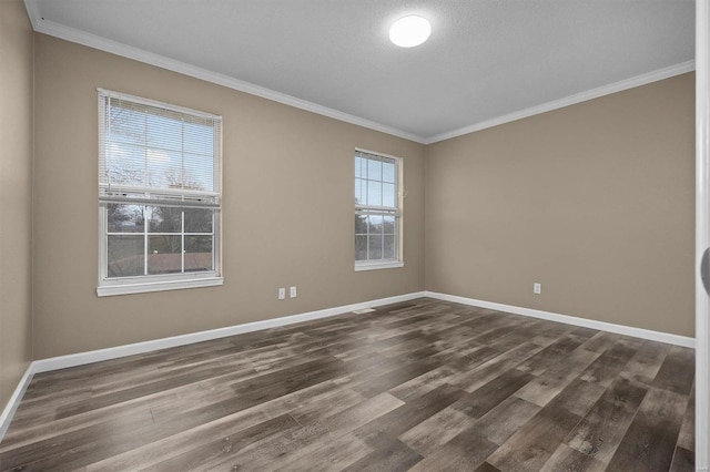 empty room with plenty of natural light, crown molding, and dark wood-type flooring