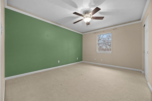 unfurnished bedroom with a textured ceiling, ceiling fan, light colored carpet, and crown molding