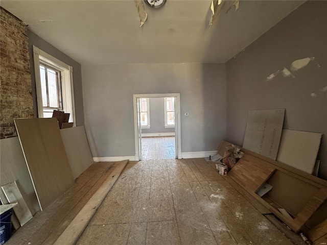 miscellaneous room featuring a healthy amount of sunlight and wood-type flooring