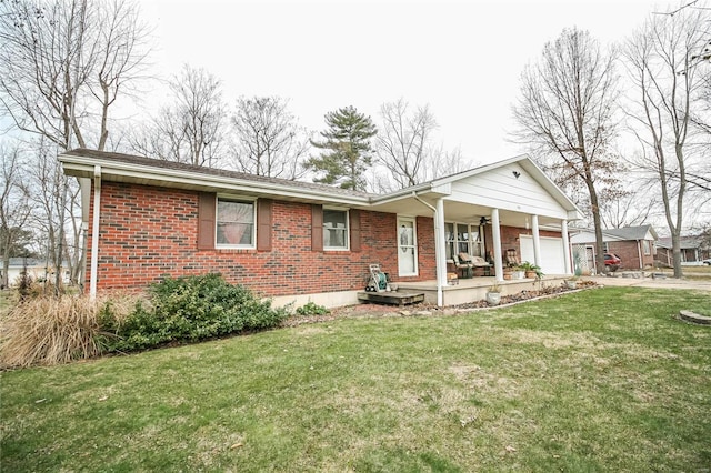 single story home featuring a garage, covered porch, and a front lawn