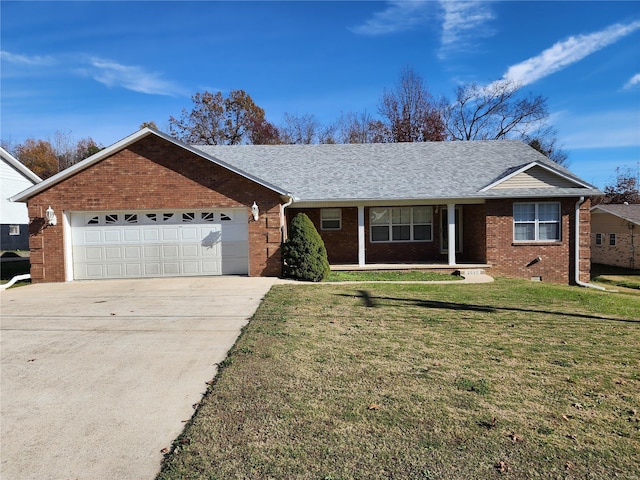 ranch-style home with a front yard and a garage