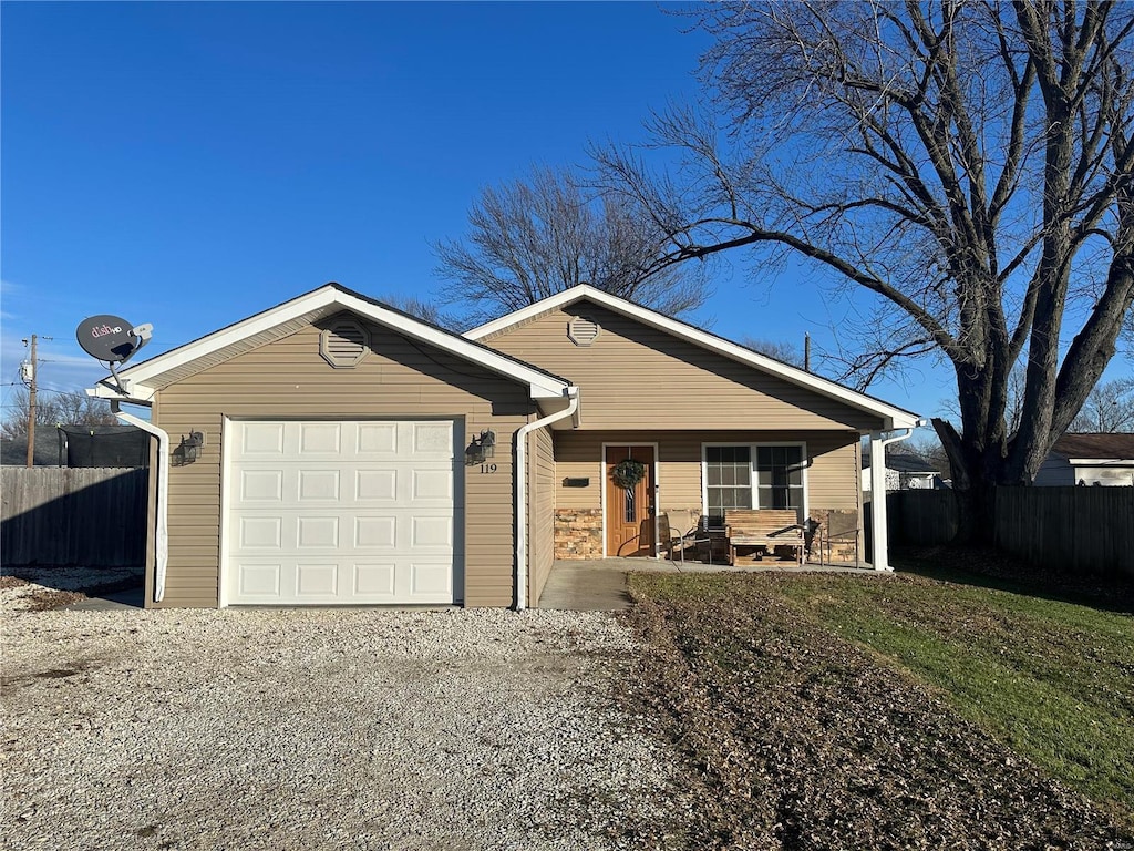 ranch-style home featuring a garage