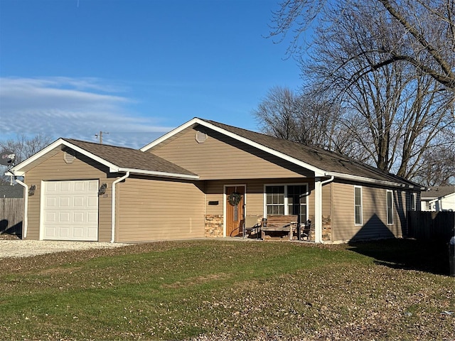 single story home with a front yard and a garage