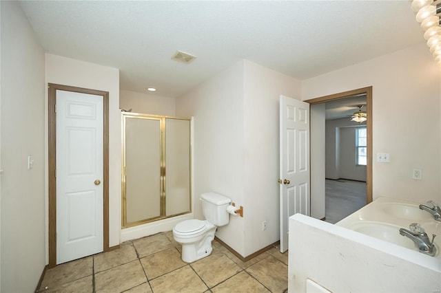 bathroom with walk in shower, tile patterned flooring, a textured ceiling, toilet, and vanity