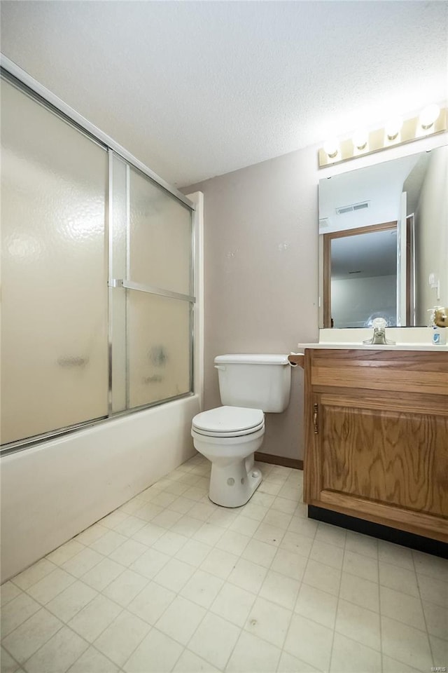 full bathroom featuring vanity, enclosed tub / shower combo, a textured ceiling, and toilet