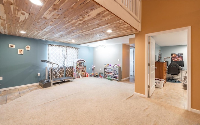 rec room featuring carpet flooring and wood ceiling