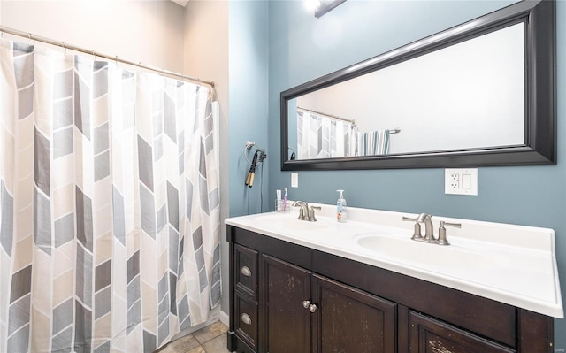 bathroom with tile patterned flooring and vanity