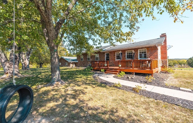 exterior space with a deck and a front lawn