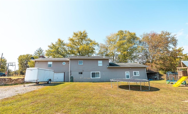 rear view of house featuring a playground, a yard, and a trampoline