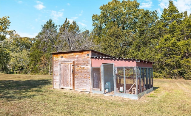 view of outdoor structure with a yard