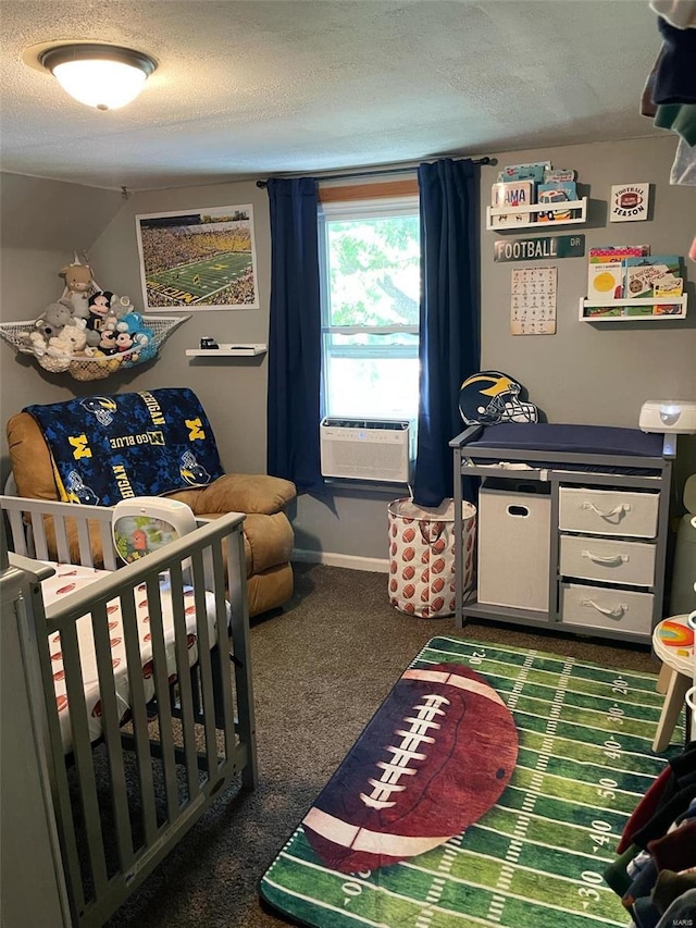 carpeted bedroom with a textured ceiling and a crib